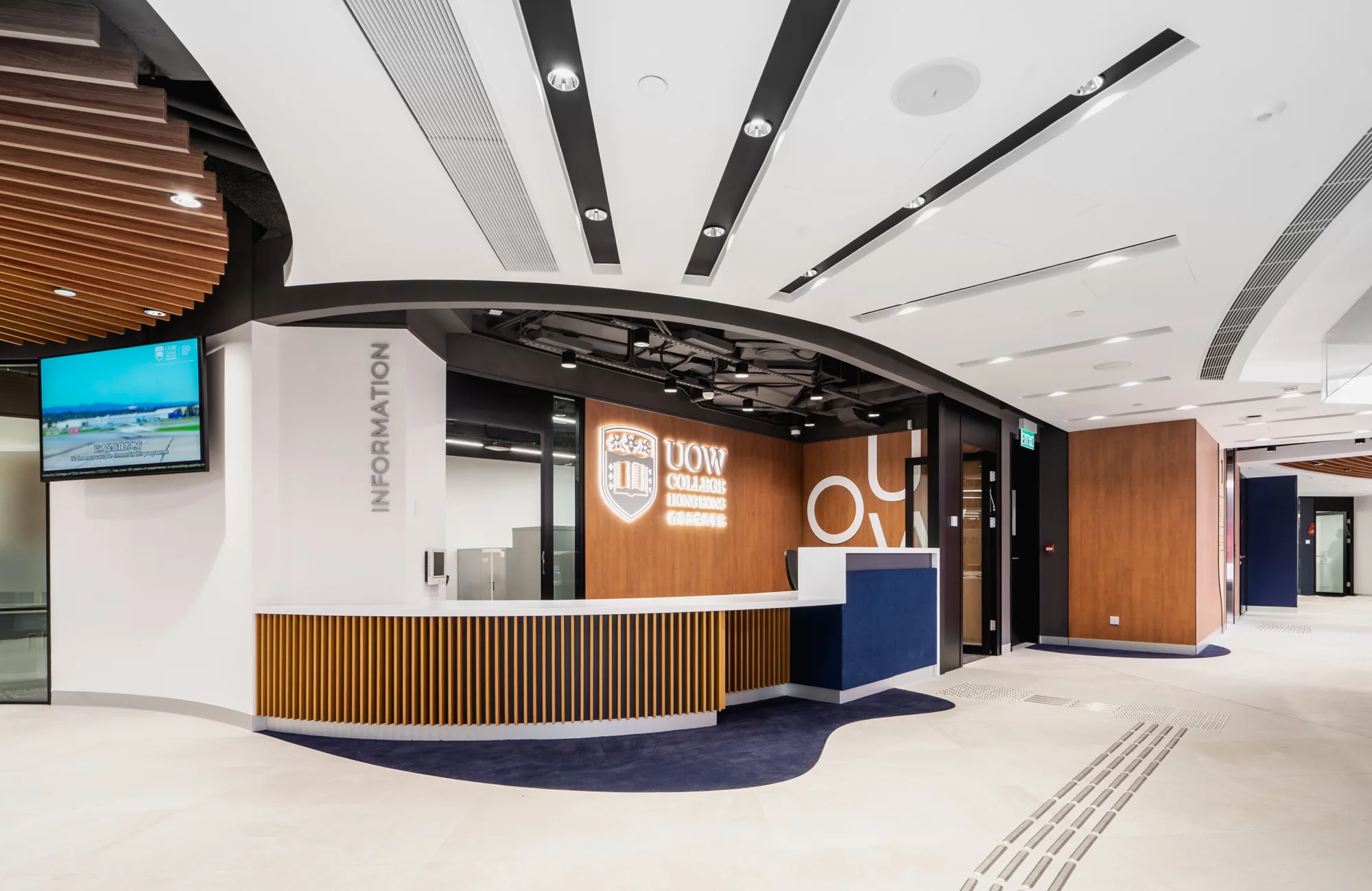 University entry reception showing desk TV screen