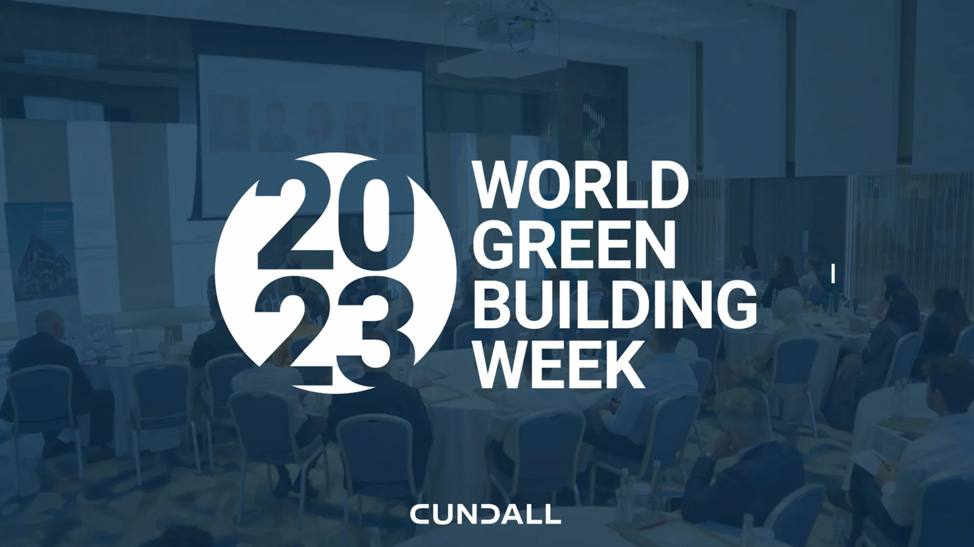 Presentation meeting space with a blue transparency and the World Green Building Week and Cundall logo