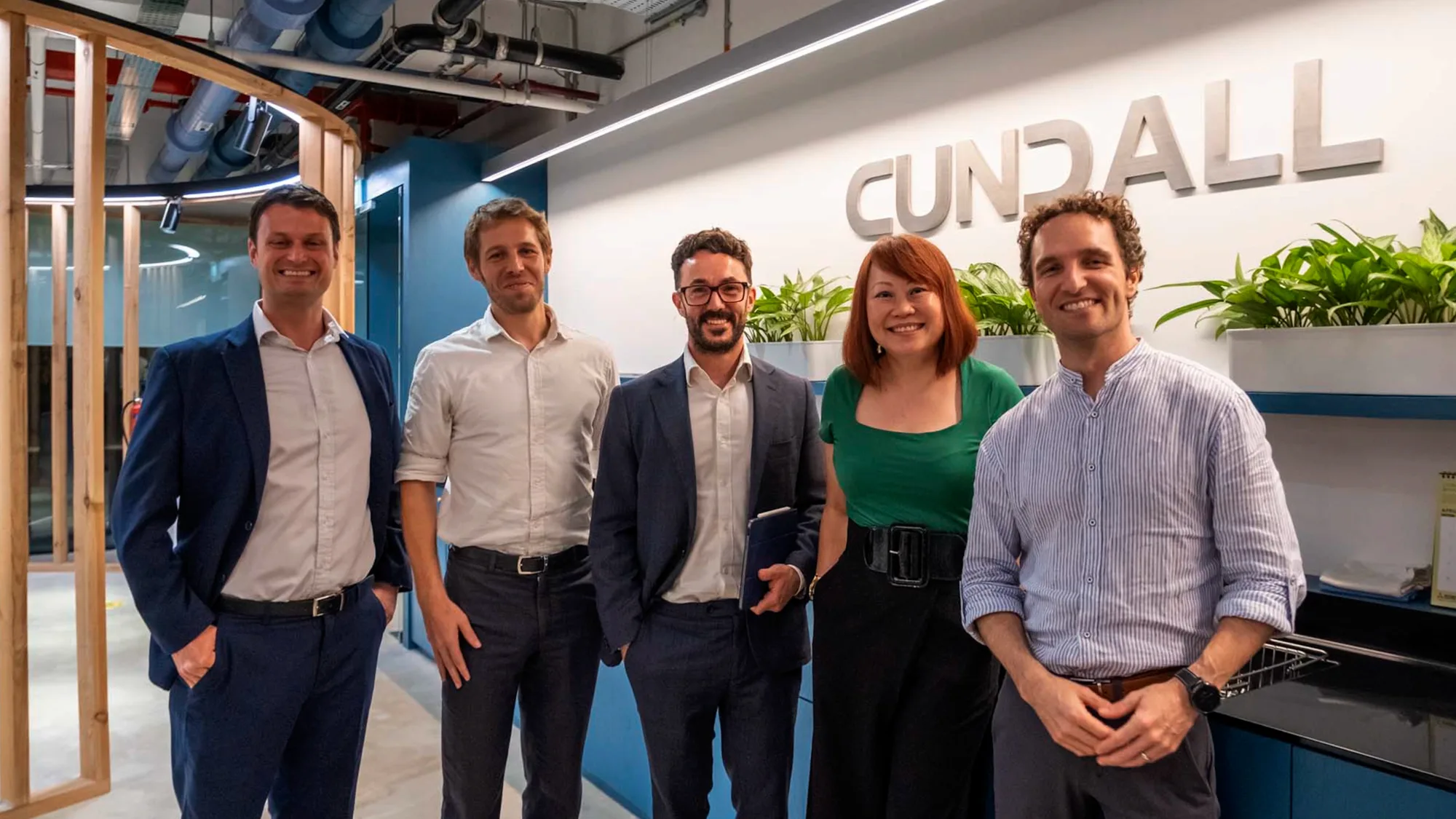 Speakers of the Data, Dollars, and Design (DDD) discussion posing for a group picture in our Cundall Singapore office